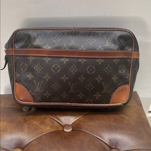 Authentic Louis Vuitton Compiegne 28 clutch bag in monogram leather.